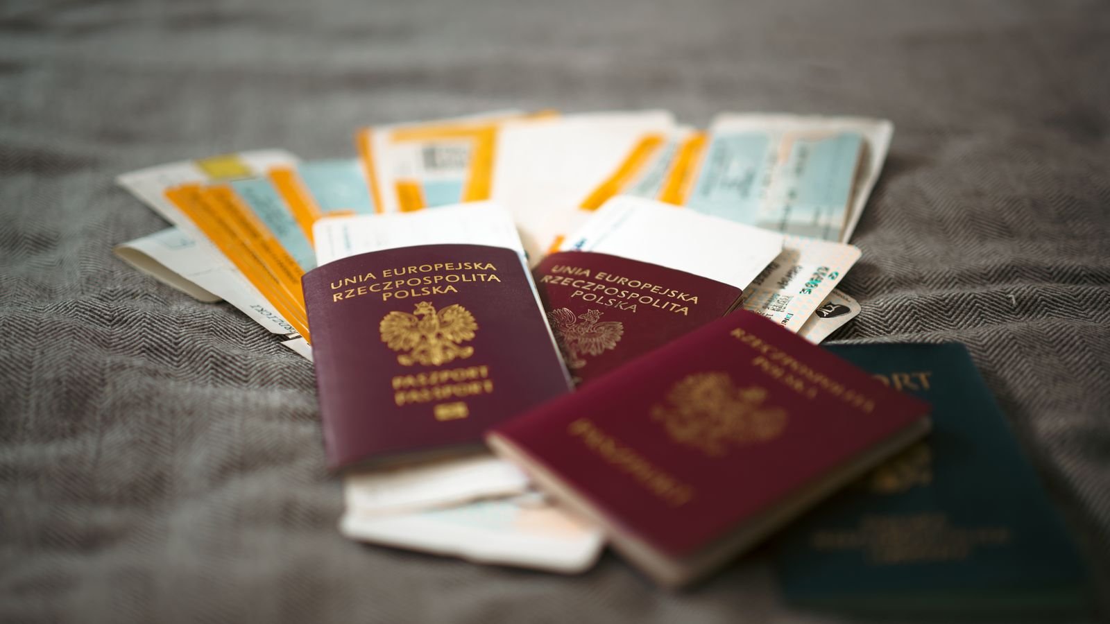 Passport and travel tickets representing Dubai tourist visa fast-track processing
