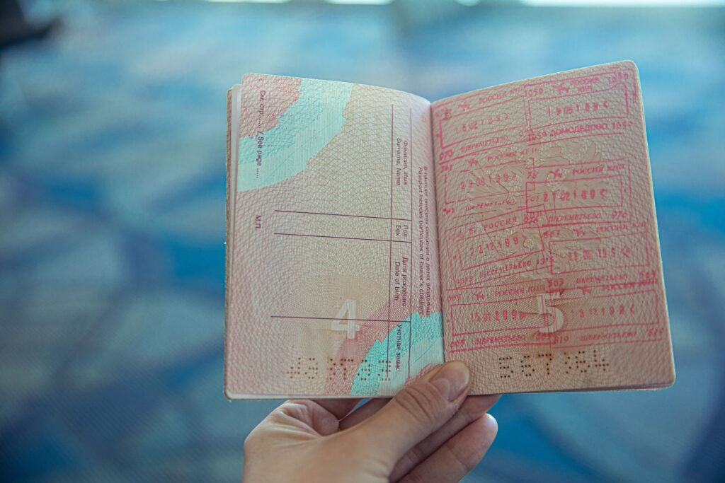 Traveler holding an opened passport, representing UAE visa on arrival eligibility for newly added nationalities in 2026