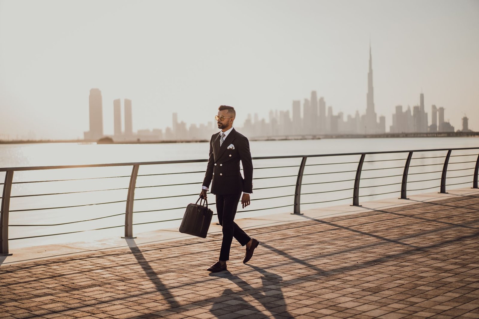 Business executive with Dubai skyline representing the UAE Golden Visa Executive category 2026