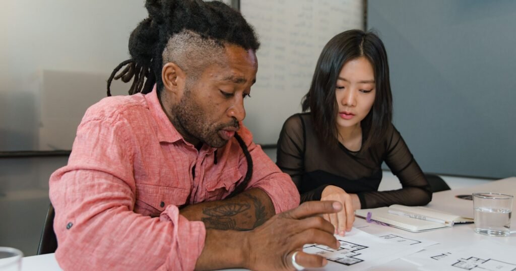 Employee filling out paperwork while on the phone, filing a labour complaint