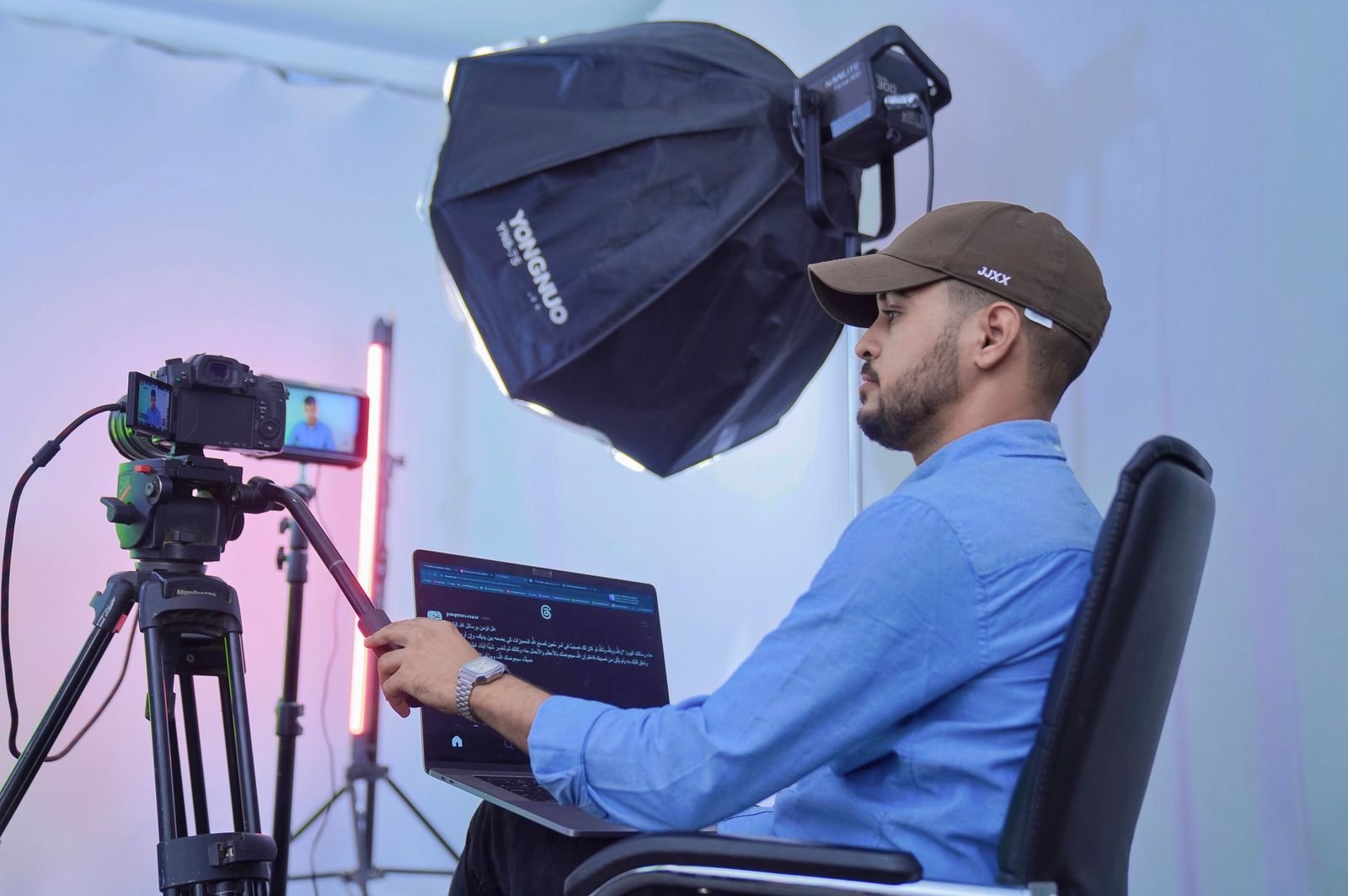 A content creator filming in a professional studio with camera and lighting equipment, representing the UAE Golden Visa Content Creators HQ category.