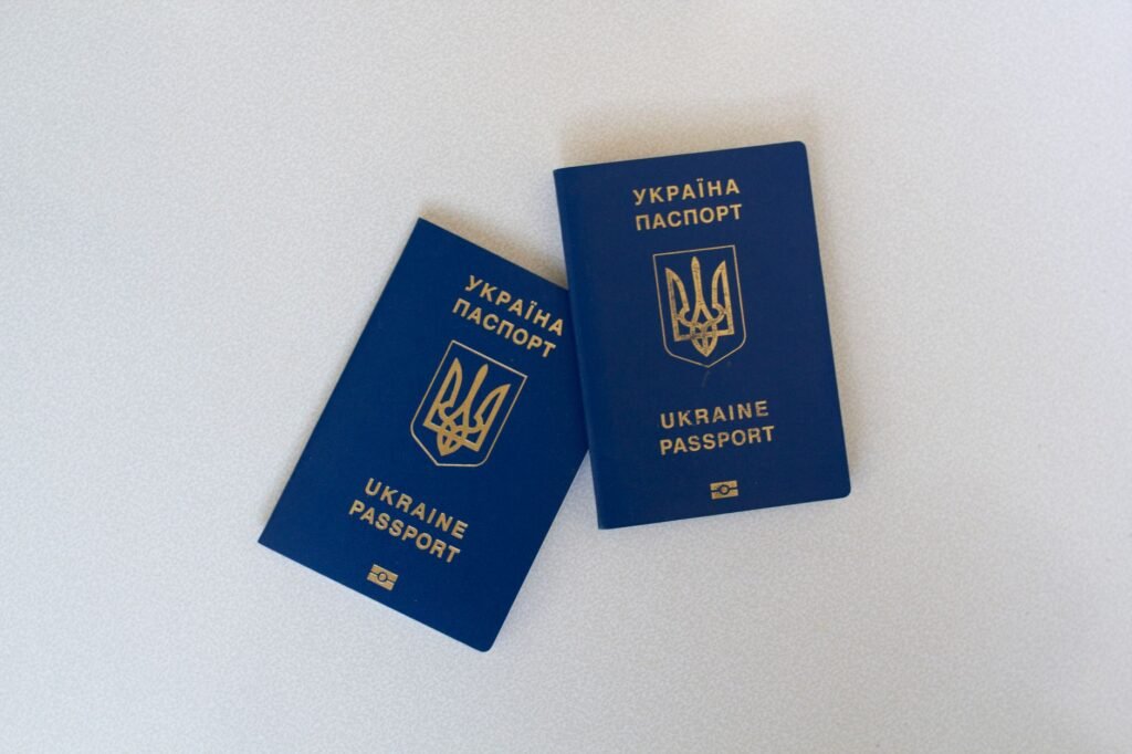 Two new passports on a desk, representing updating UAE residence records after a passport renewal