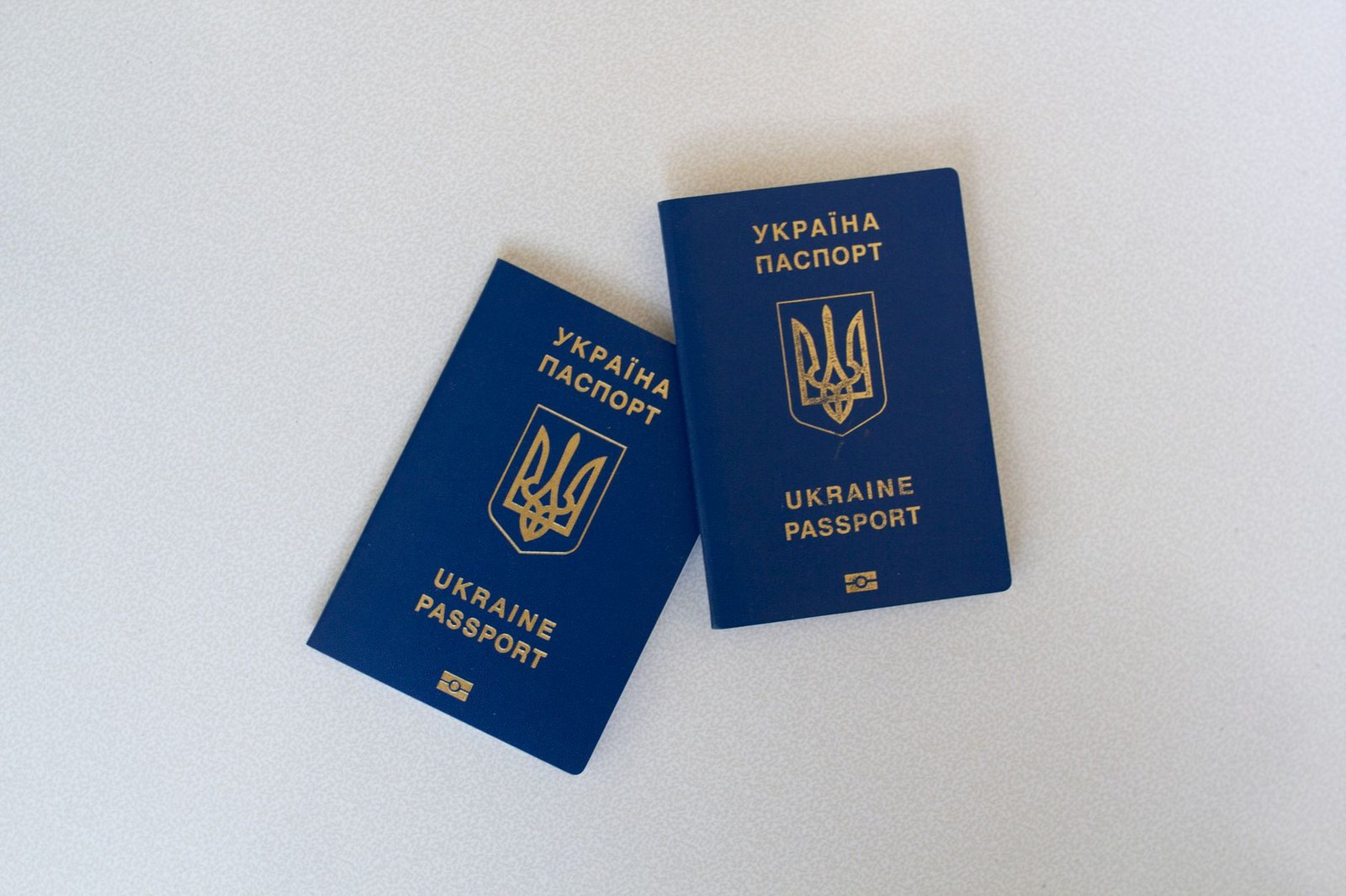 Two new passports on a desk, representing updating UAE residence records after a passport renewal