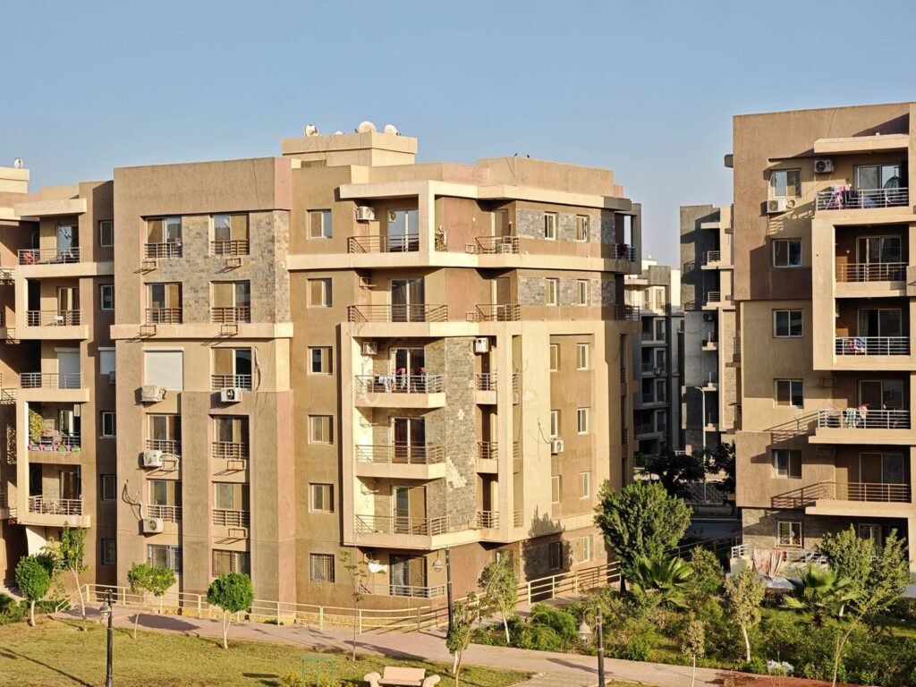 Residential apartment buildings in a city, representing tenancy contract registration in Abu Dhabi