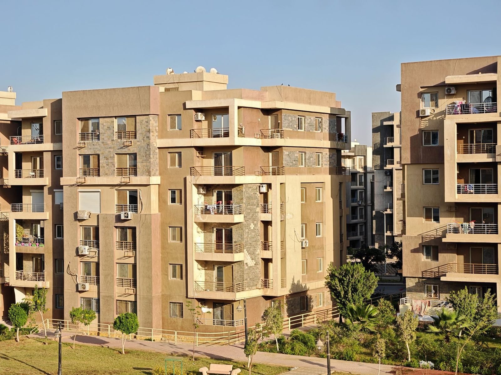 Residential apartment buildings in a city, representing tenancy contract registration in Abu Dhabi