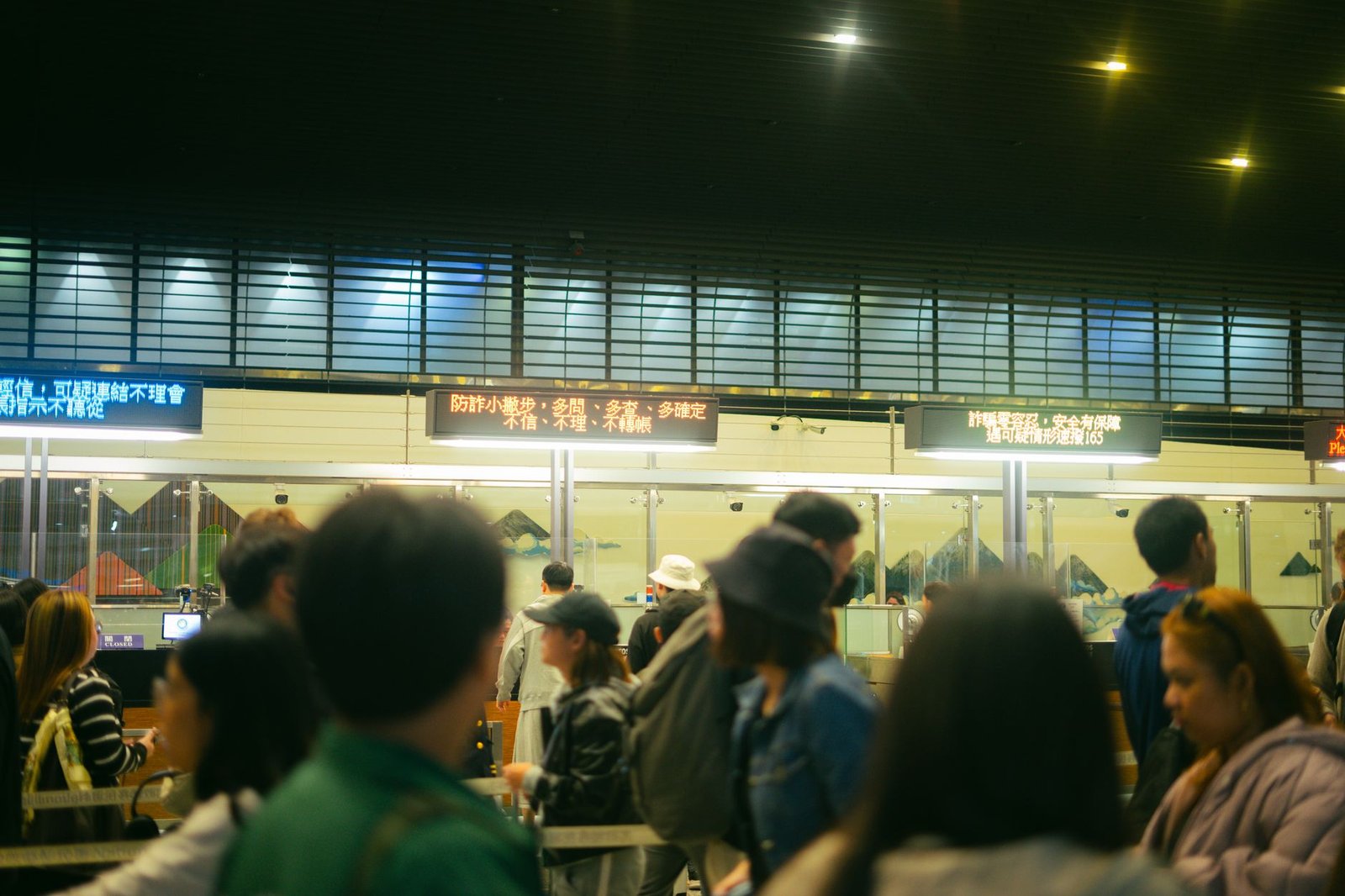 Crowded airport check-in area with travellers queueing, representing a UAE travel ban check before flying